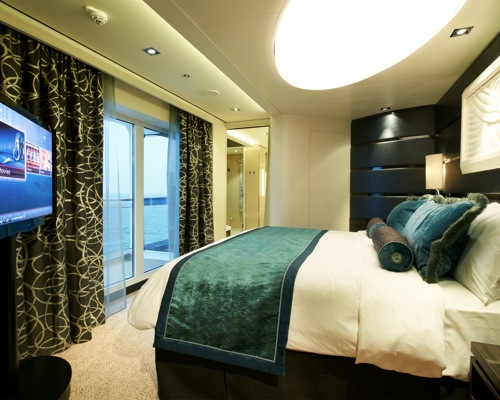 Norwegian Cruise Line Norwegian Breakaway Accommodation The Haven Deluxe Owner Suite Bedroom.jpg