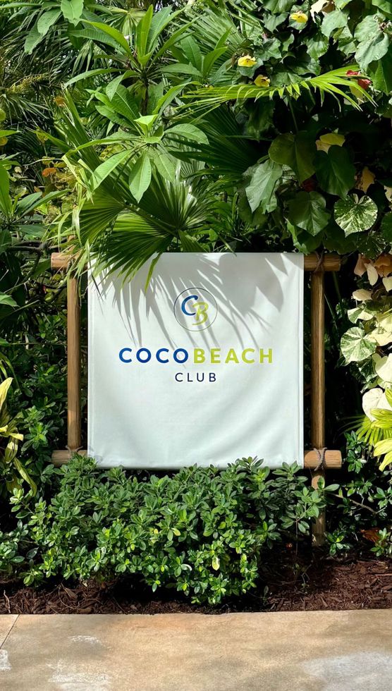 A sign that says 'Coco Beach Club' at CocoCay.