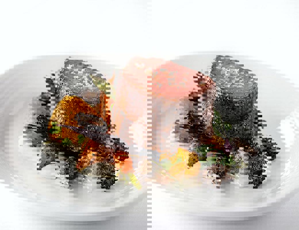 RCI Mariner of the Seas Main Diningmain-dining-room-sliced-steak-topped-with-sea-salt.jpeg