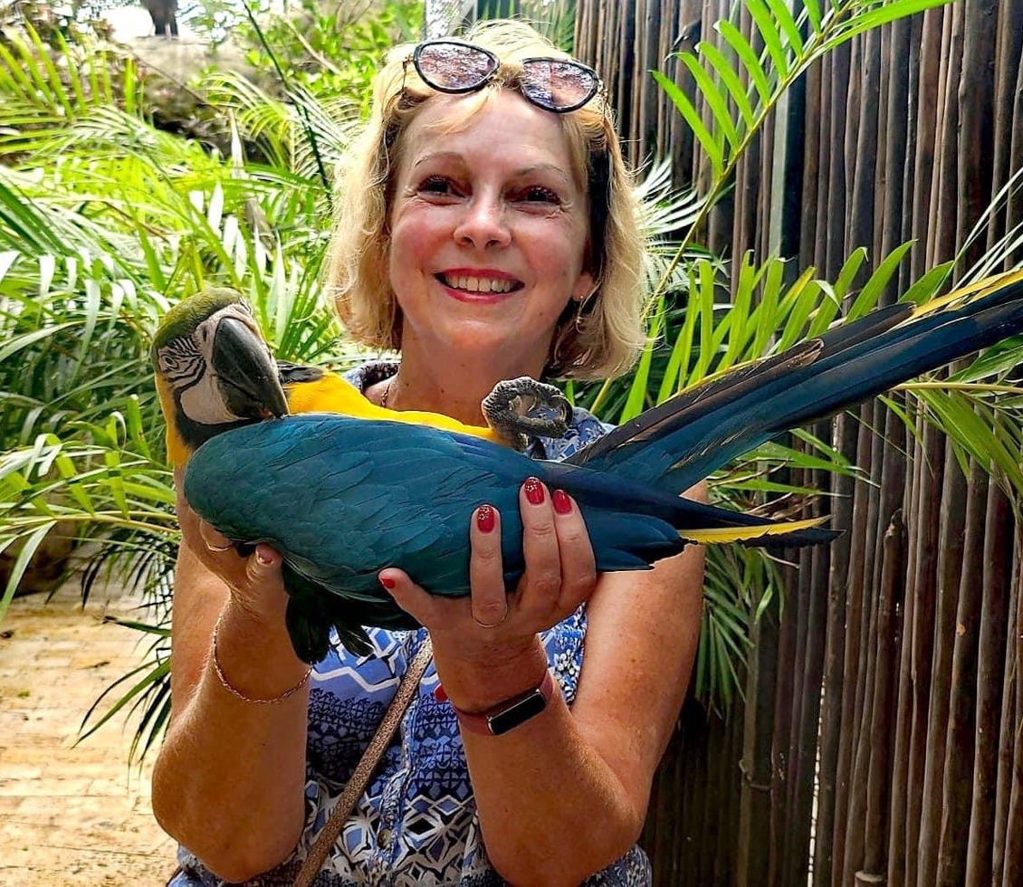 Lady holding a parrot