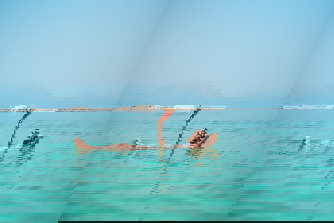 Man floating on Dead Sea 
